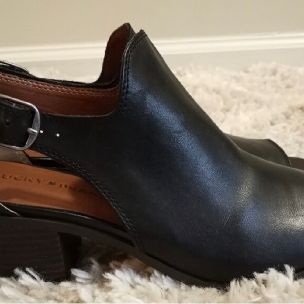 Lucky Brand opened toe, leather upper, block heel, man made lining and sole.
